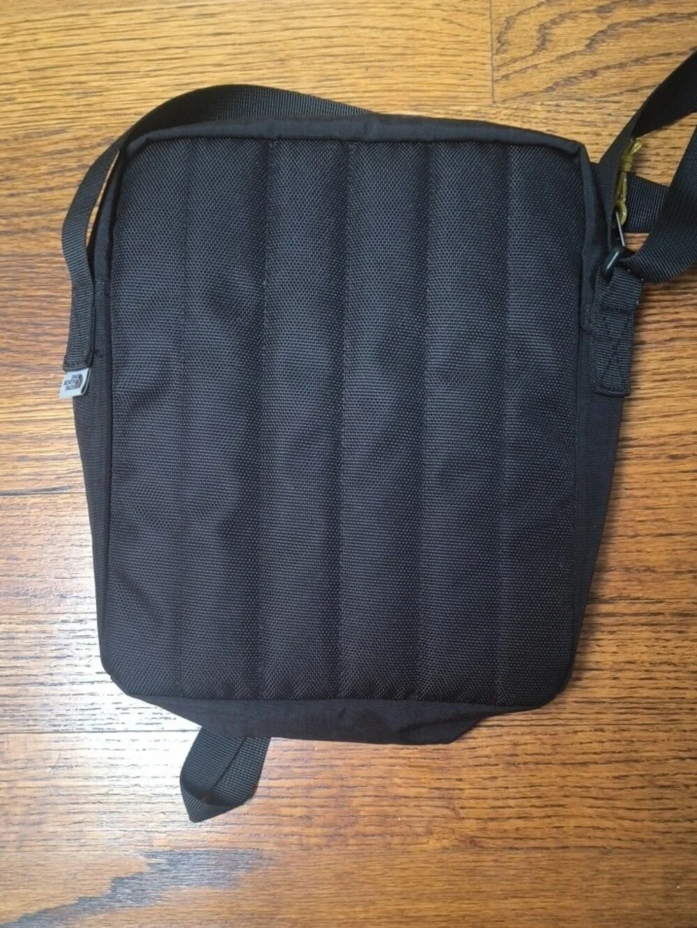 The North Face Black Crossbody Pack with Yellow Cord Pulls